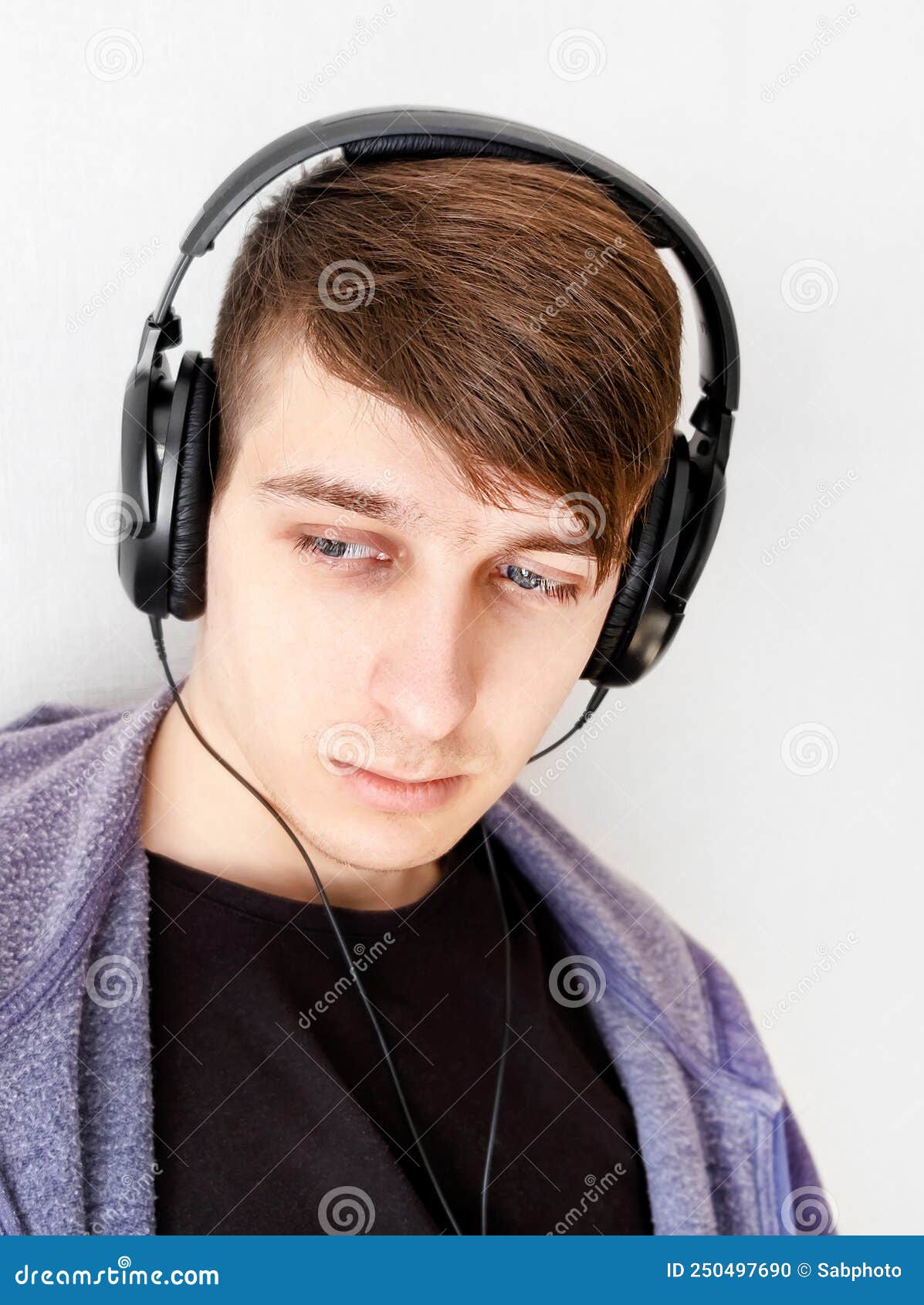 Sad Man in Headphones stock photo. Image of listen, male 250497690