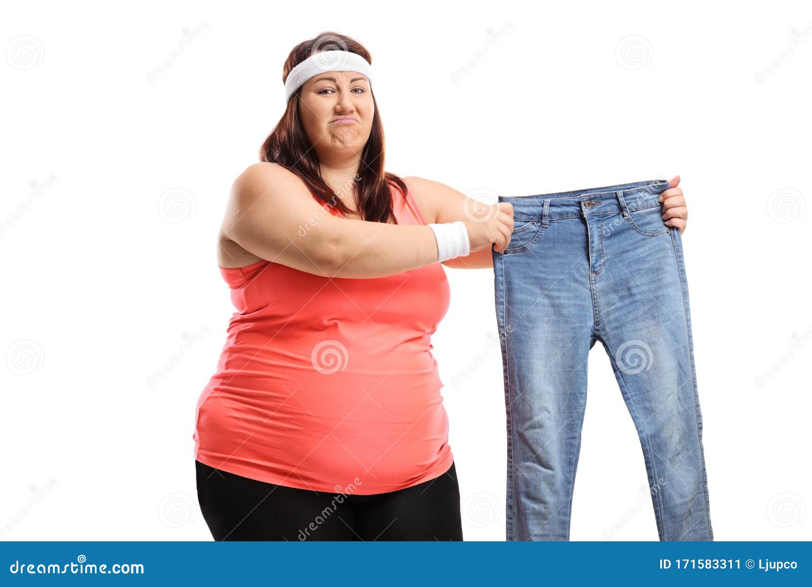 Sad Overweight Woman in Sportswear Holding a Pair of Small Jeans Stock ...