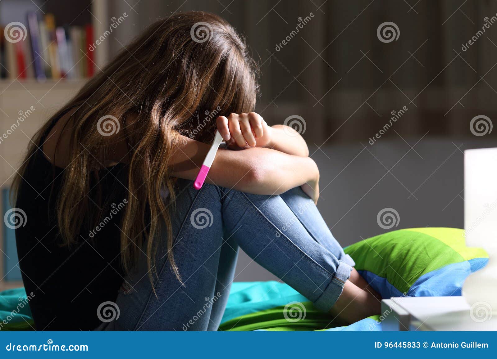 sad pregnant teen after pregnancy test