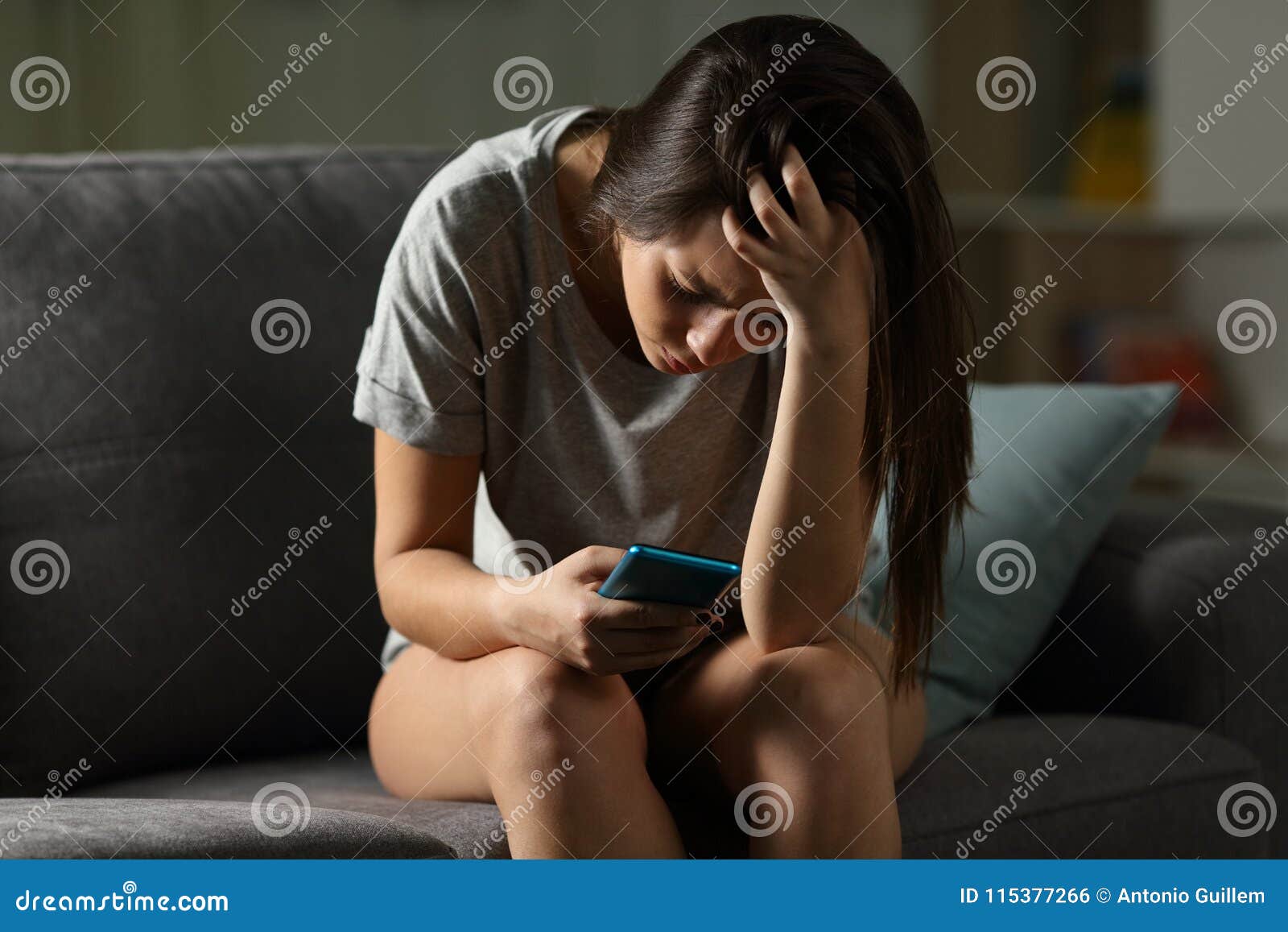 sad teen being victim of cyber bullying online