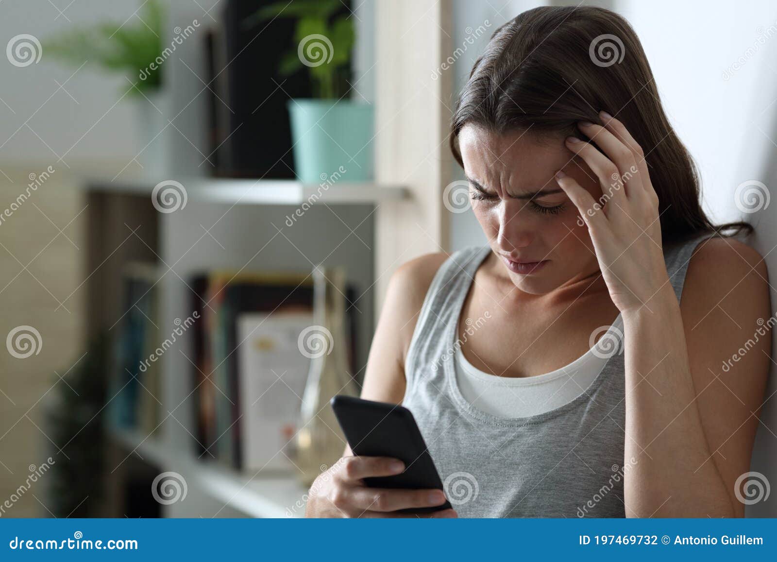 Sad Teen Checking Smart Phone At Home In The Night Stock Photo - Image