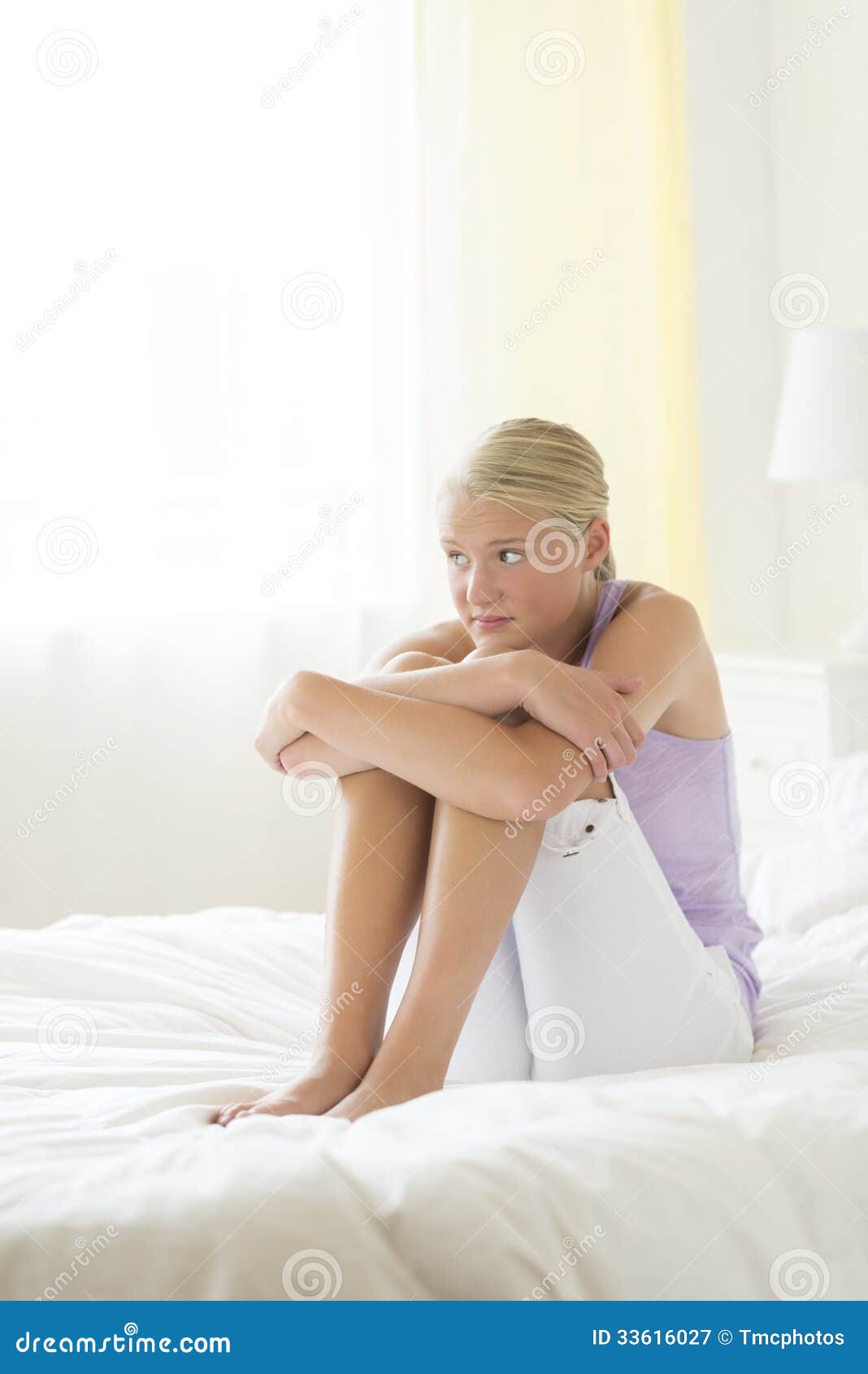Sad Teenage Girl Hugging Knees On Bed Stock Image - Image of leisure