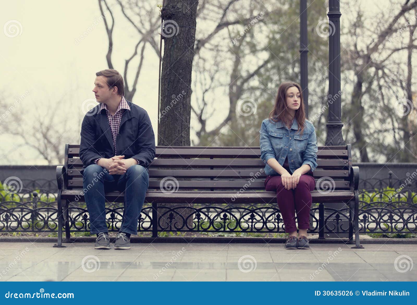 Sad Teens Sitting at the Bench at the Park Stock Photo Image of