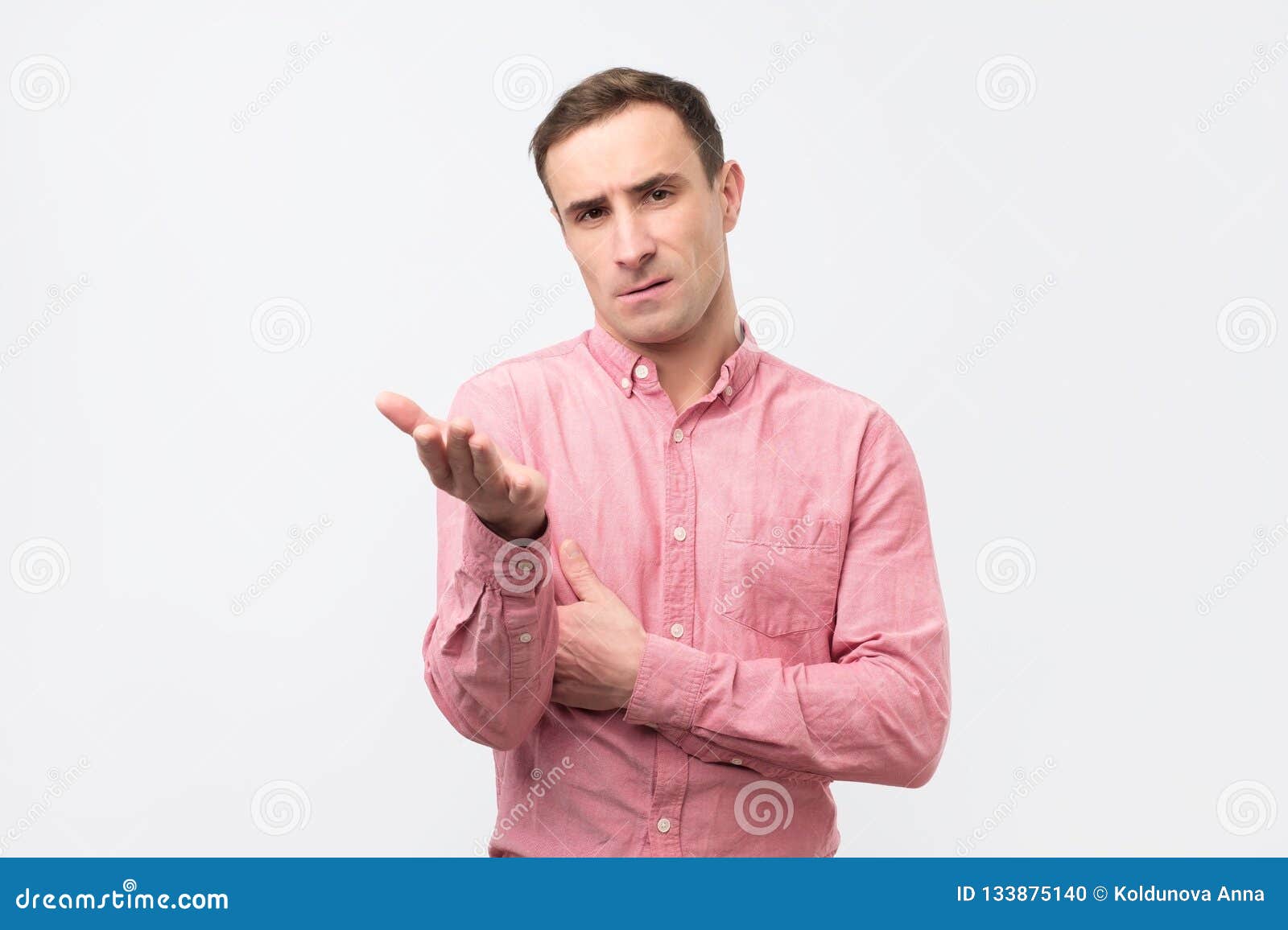 Sad Unhappy Young Man in Pink Shirt Has Grumpy Expression after Quarrel ...