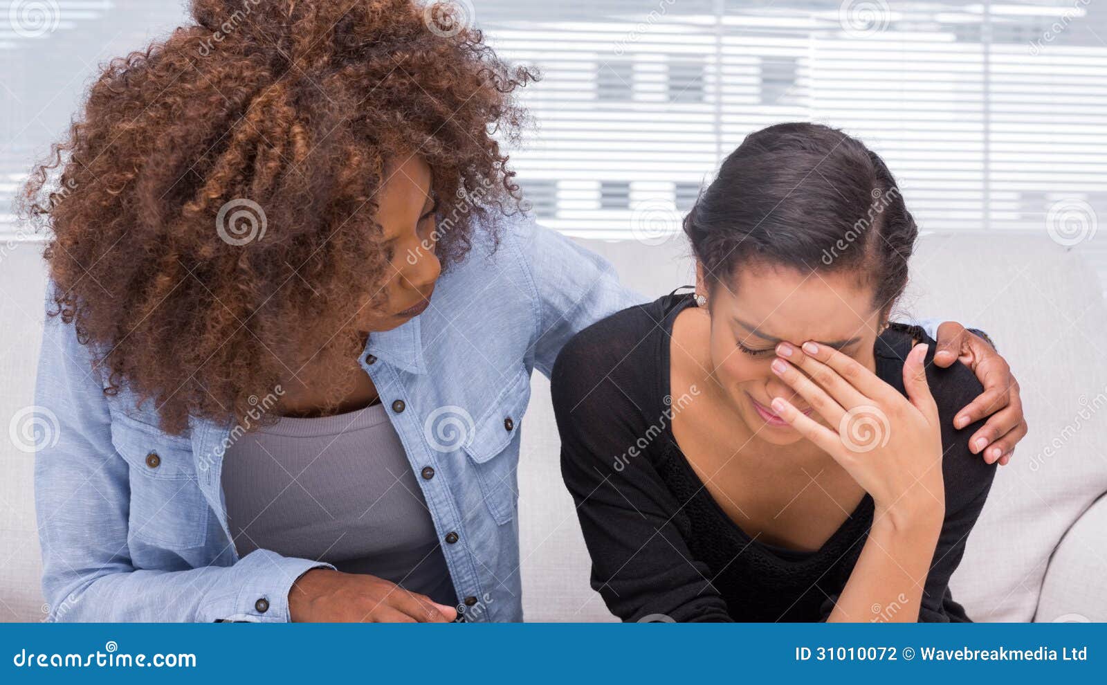 sad woman crying next to her therapist