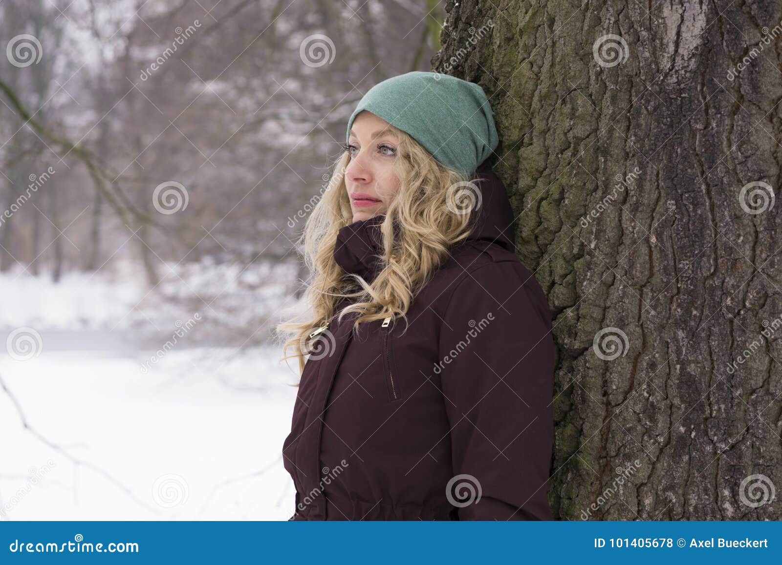 Sad Woman Leaning Against Tree in Winter Stock Photo - Image of alone ...