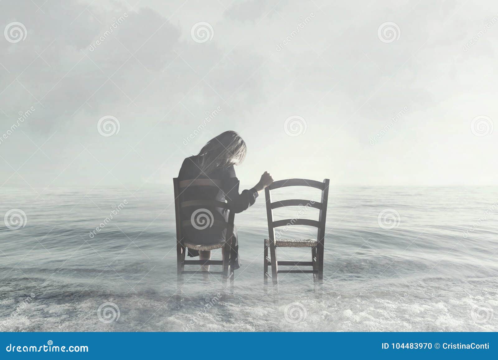 sad woman looking nostalgically at her lover`s empty chair