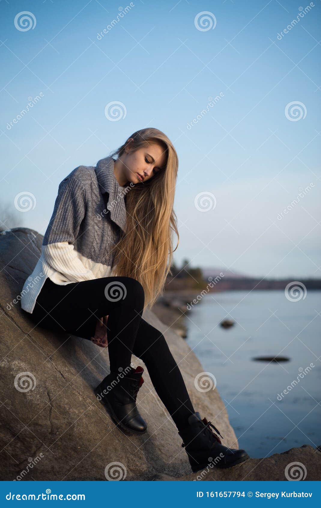 Sad Young Girl Sitting Alone on a Stone Outdoors. Teenage Girl ...