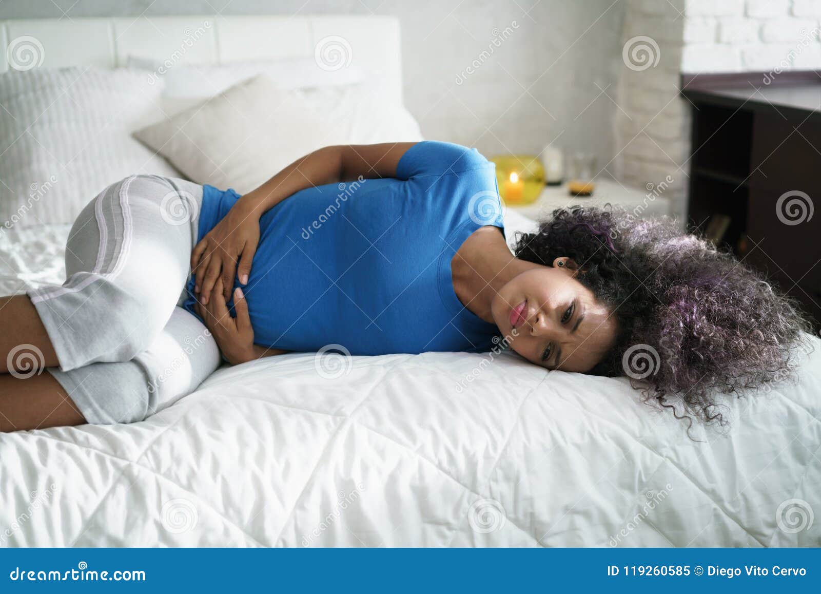 beautiful hispanic girl feeling pain during period