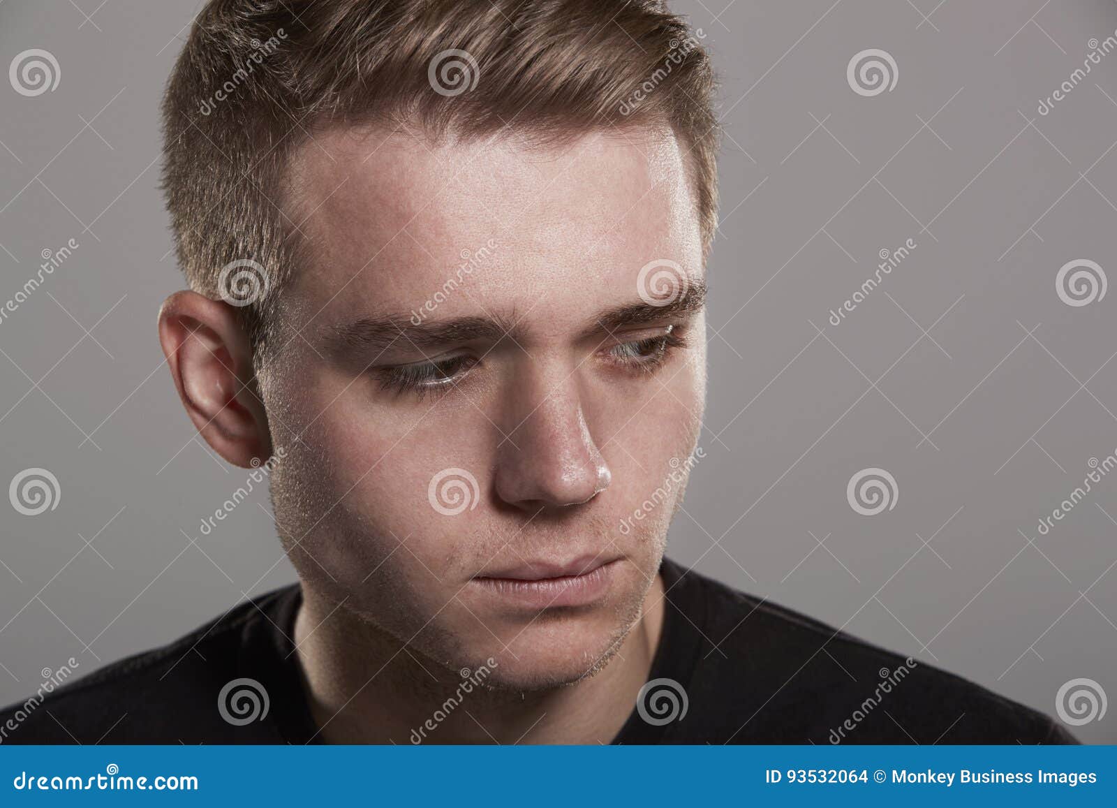 Sad Young White Man Looking Away, Head and Shoulders Stock Photo ...