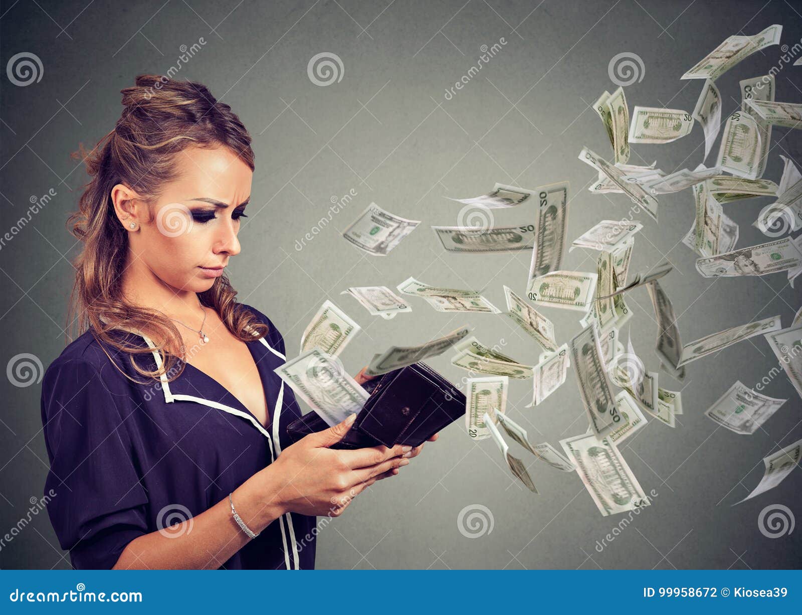 sad young woman looking at her wallet with money dollar banknotes flying out away