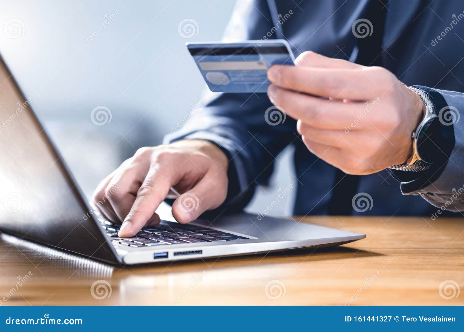 safe online payment and electronic money transfer security. pay with digital technology. man using credit card and laptop.