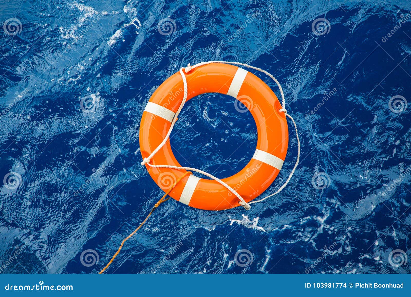 safety equipment, life buoy or rescue buoy floating on sea to rescue people from drowning man