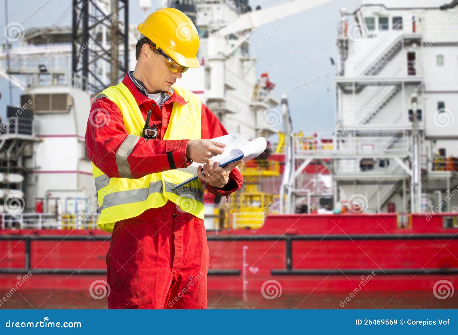 Safety Officer, Standing On An Industrial Ship, Wearing Overalls, A