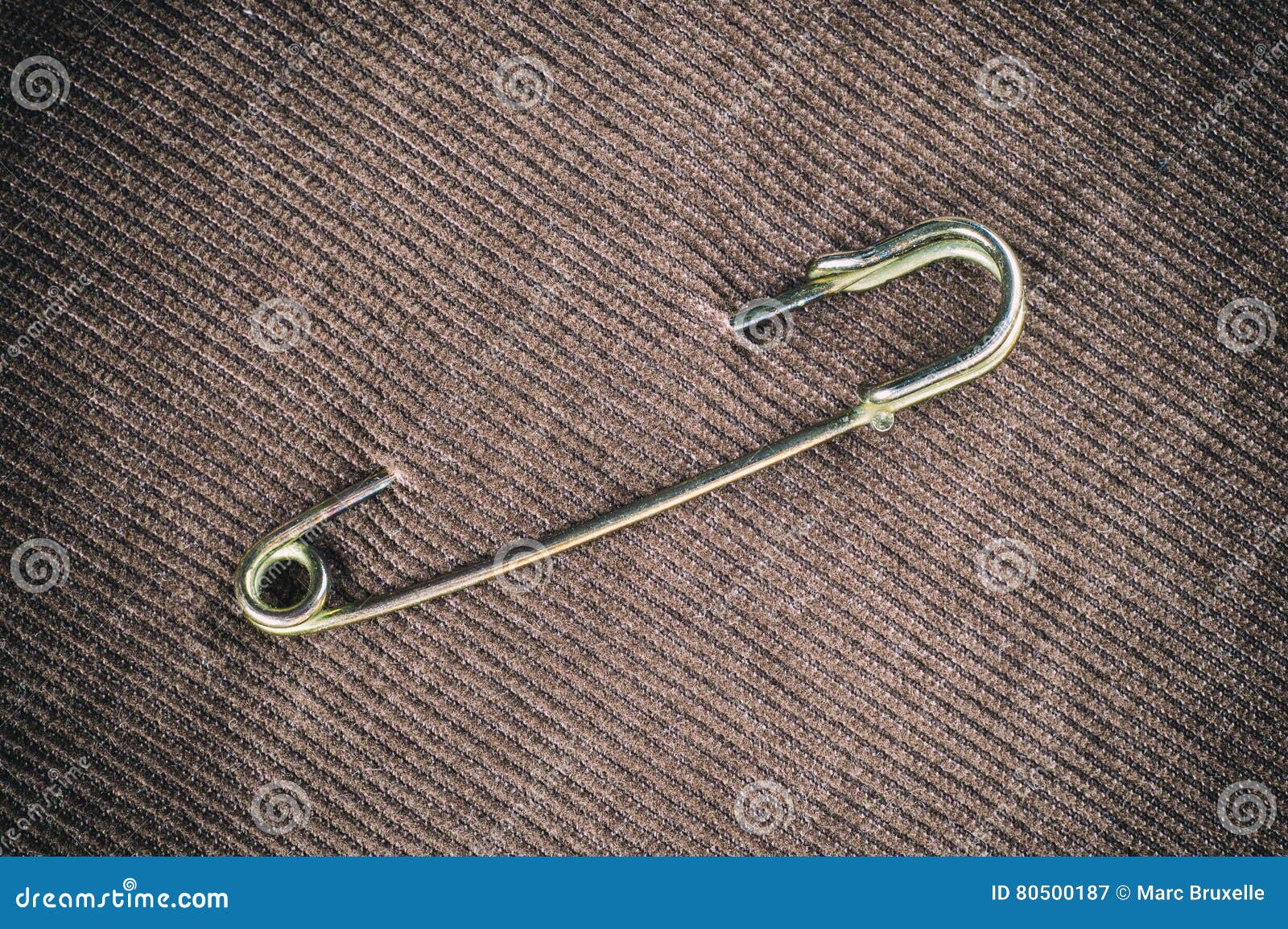 Safety pin on clothes stock image. Image of religious - 80500187