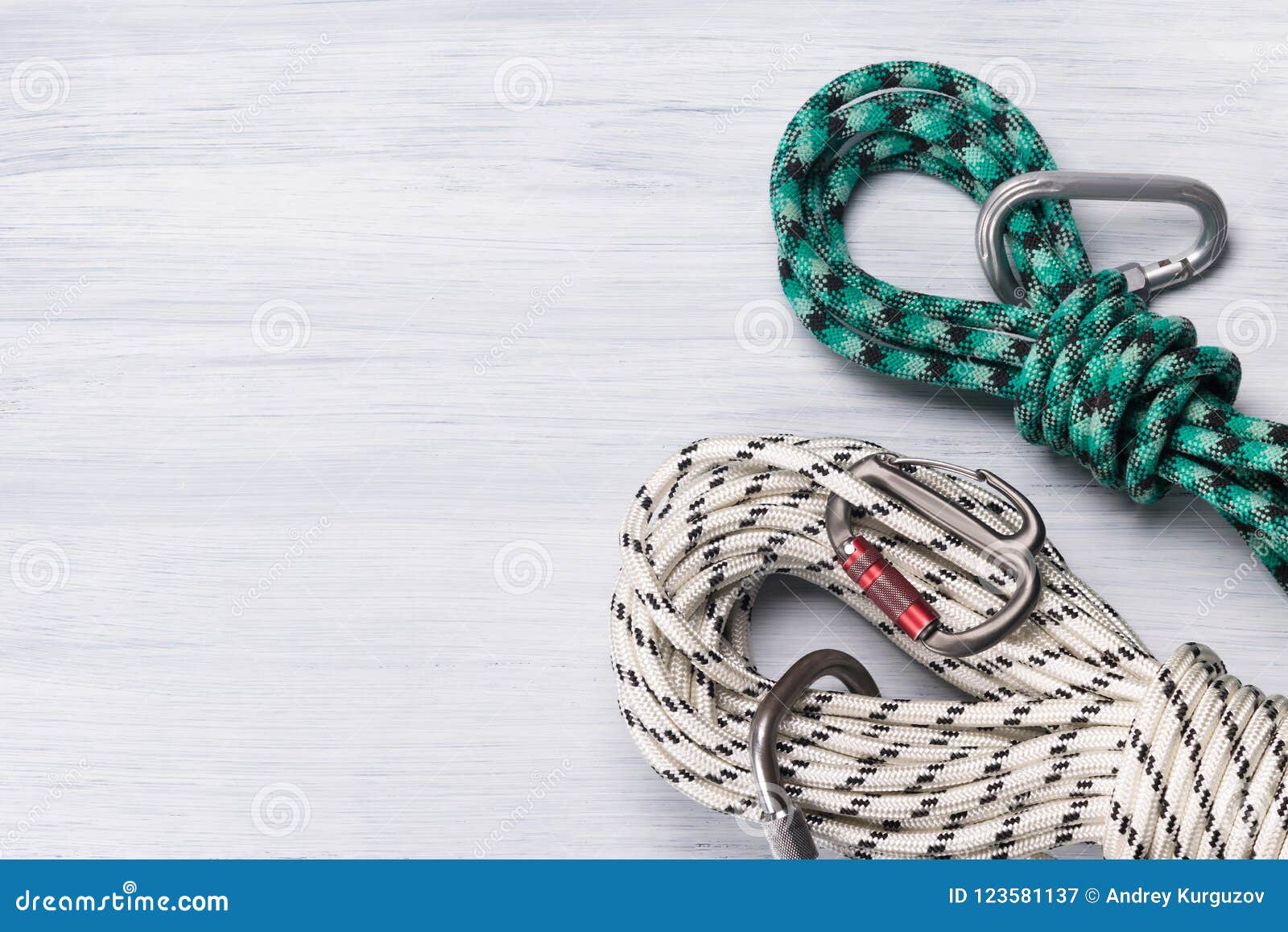 Safety Ropes with Snap Hooks for Climbing on a Light Background