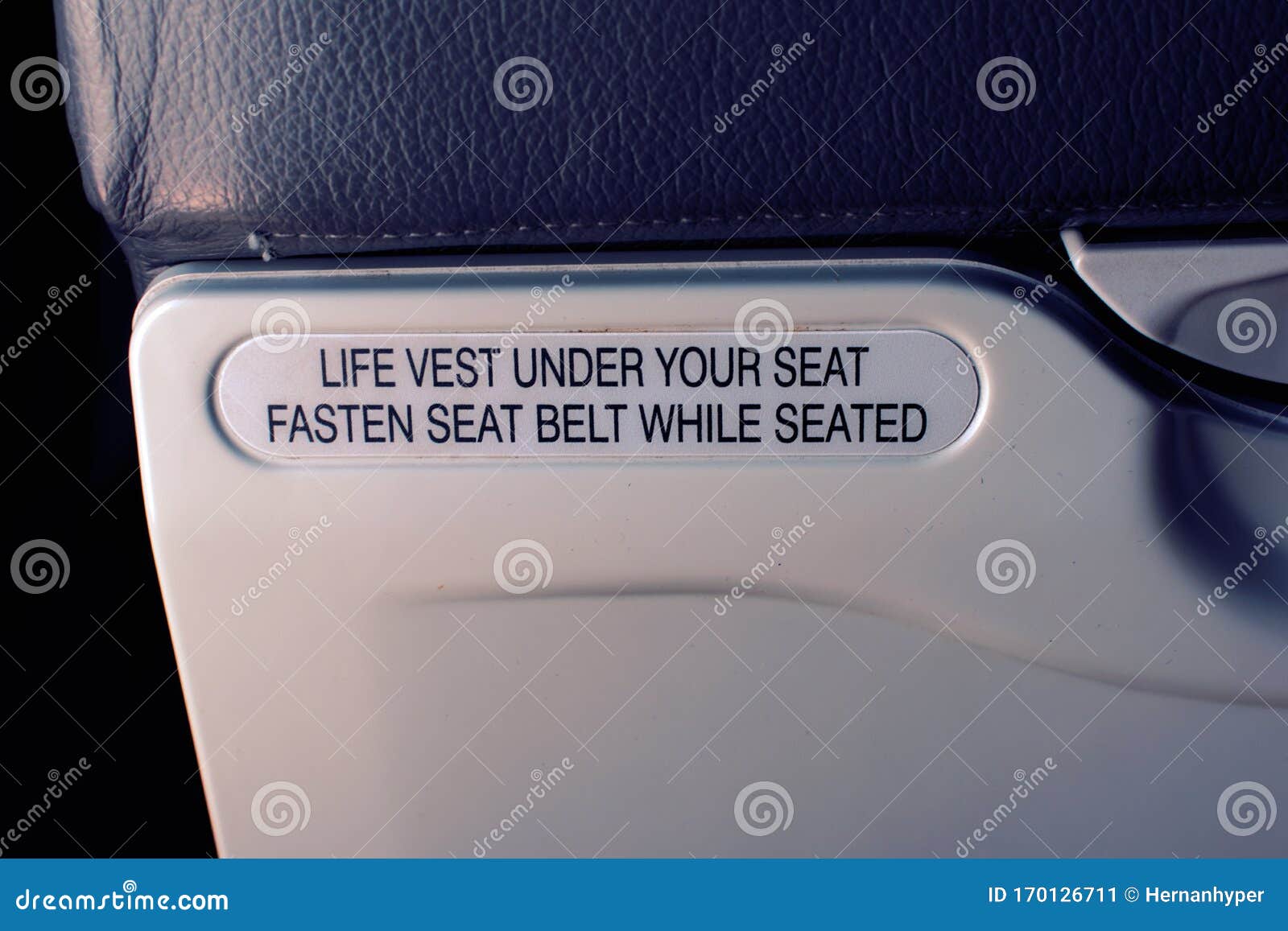 Safety Sign on a Commercial Aircraft, Indicating To Fasten Seat Belt