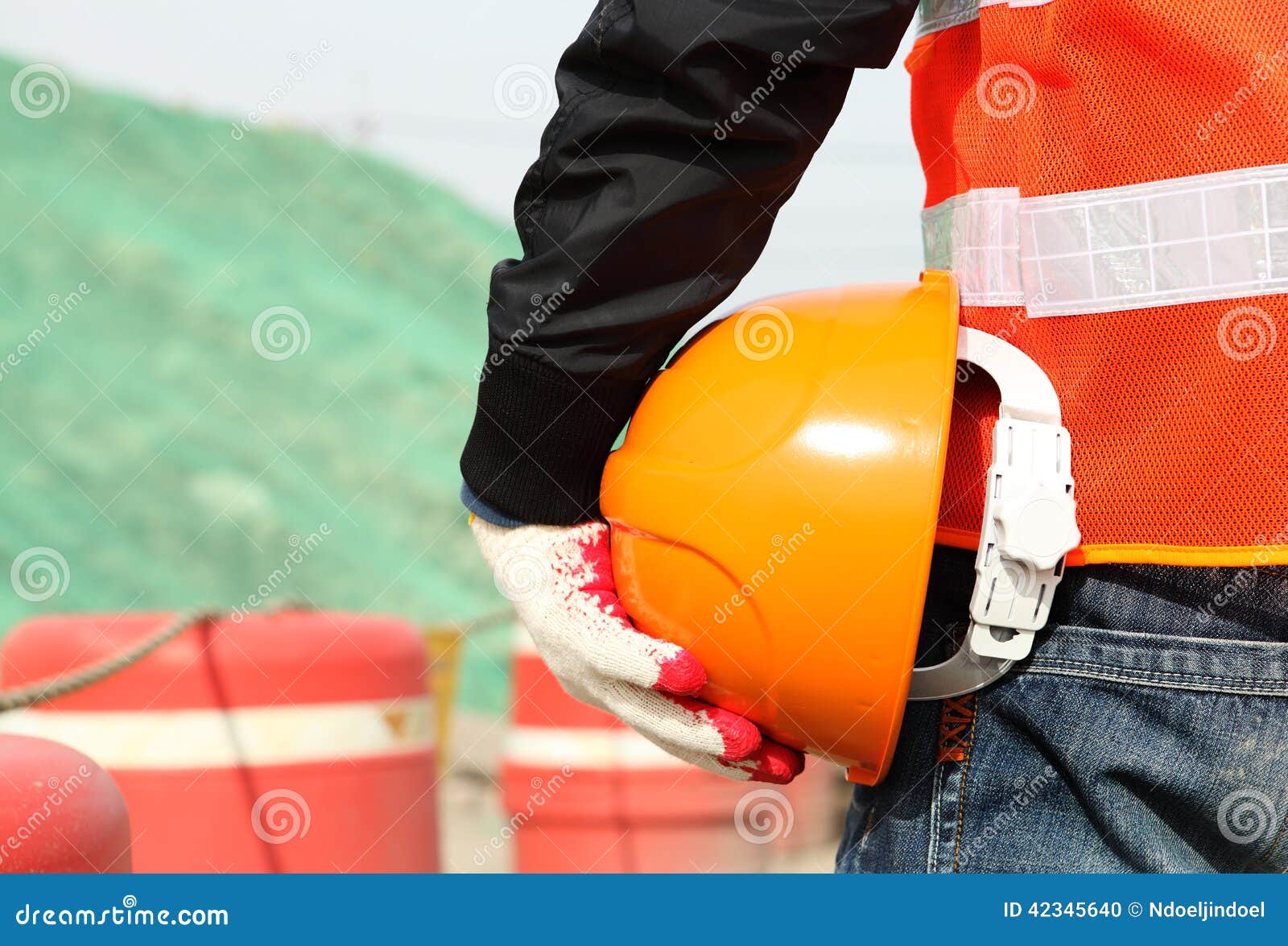 safety work concept, construction worker holding helmet