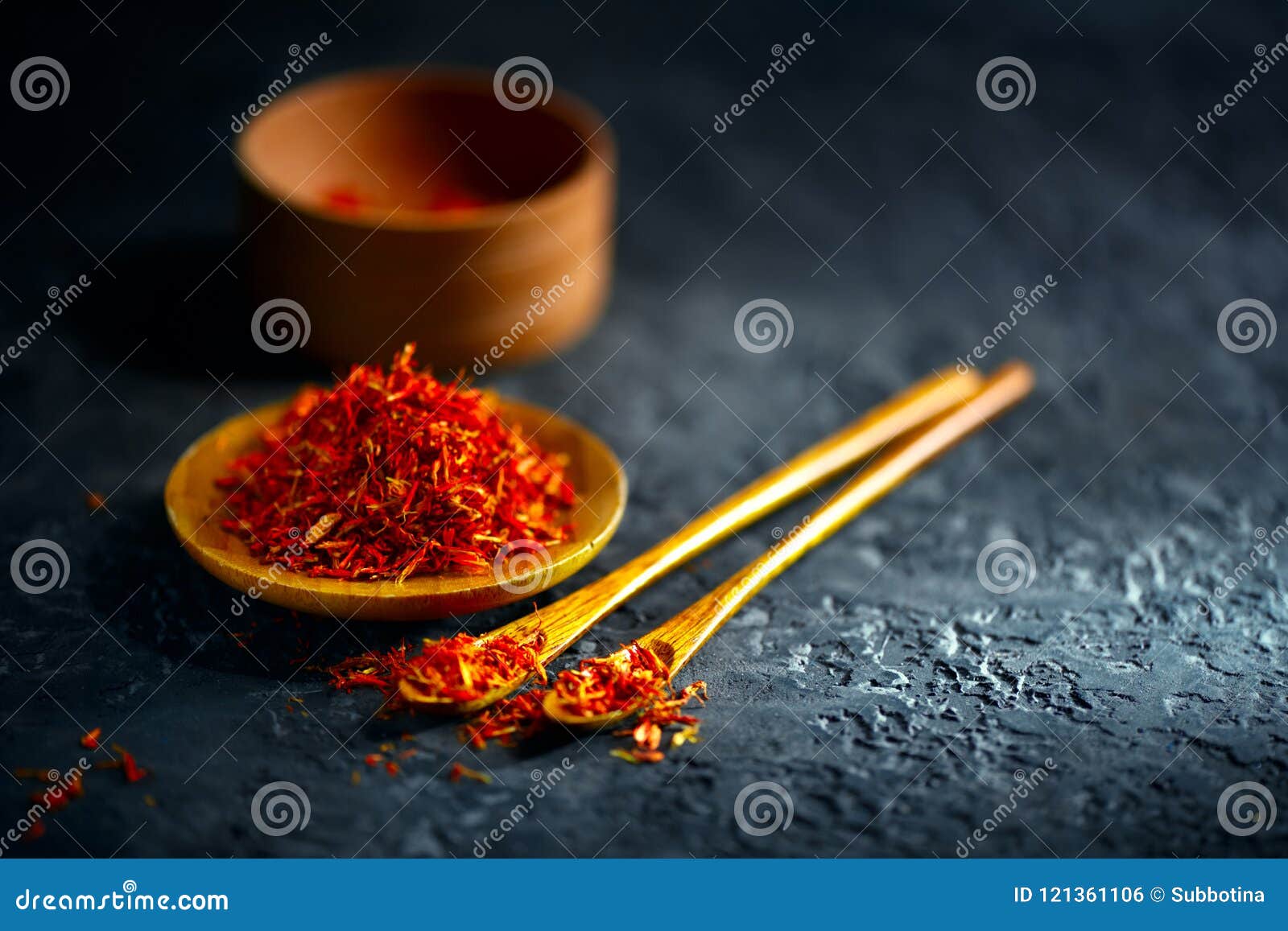 https://thumbs.dreamstime.com/z/saffron-spices-saffron-black-stone-table-wood-bowl-spoon-spice-herbs-slate-background-cooking-ingredients-121361106.jpg