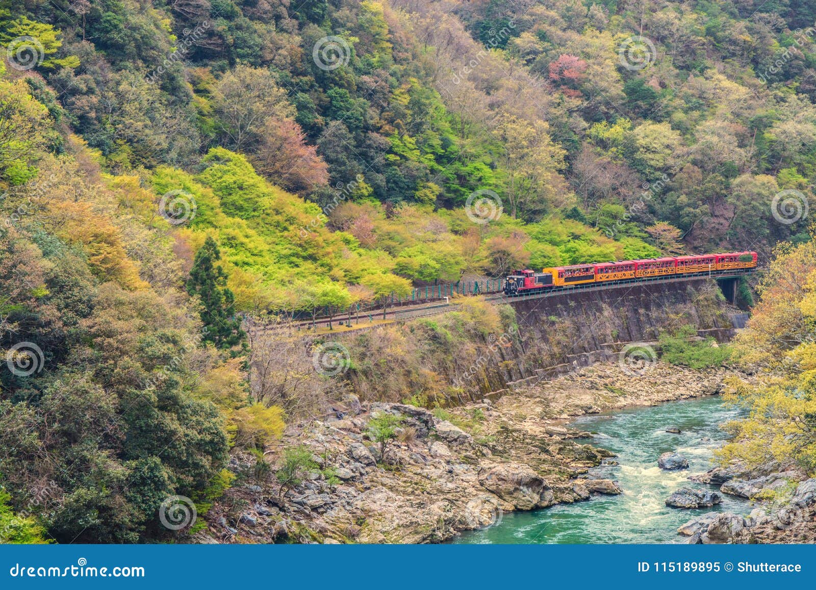 sagano romantic train running above river kyoto japan