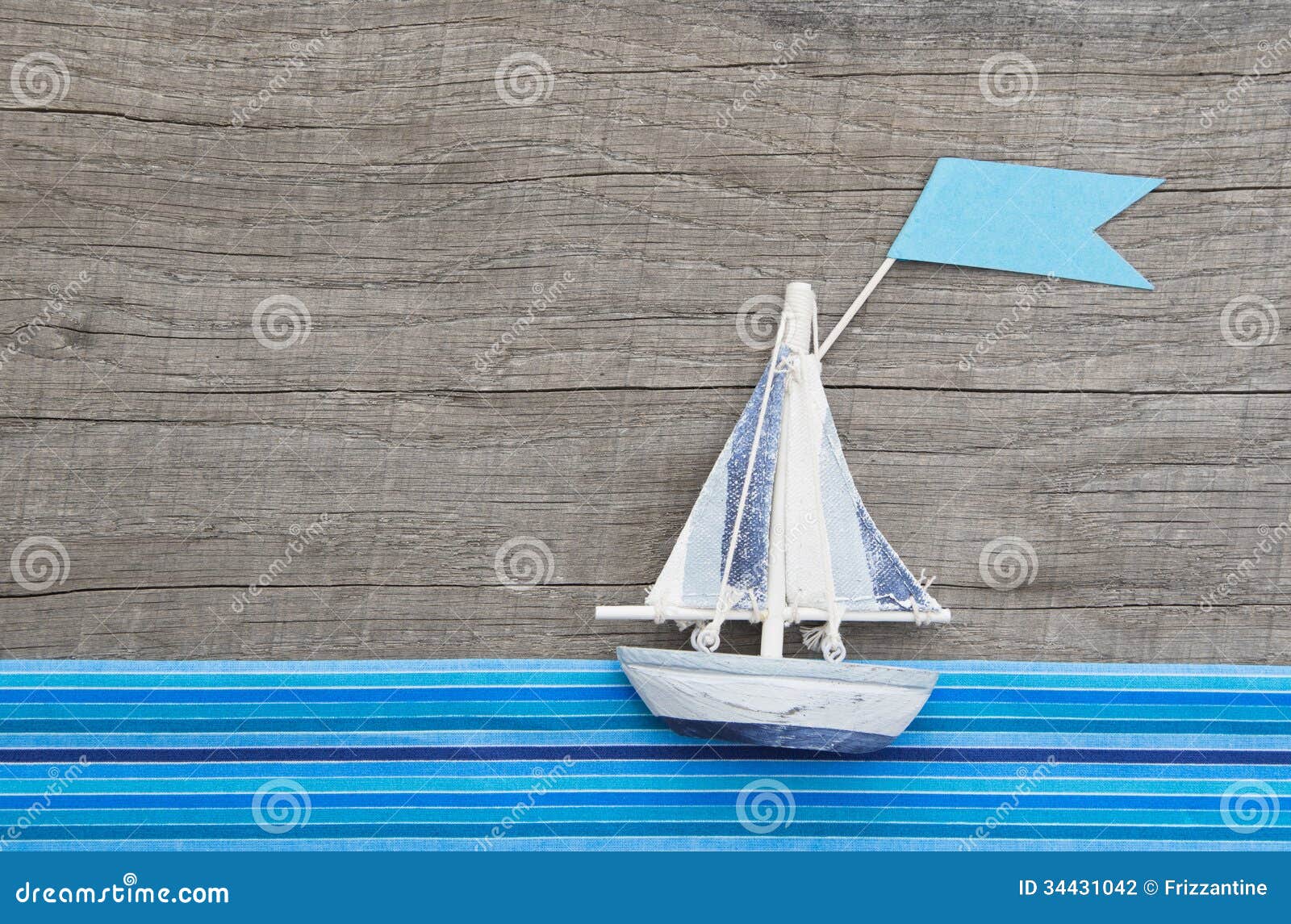 Sailboat With Flag On Grey Wooden Background With Blue 