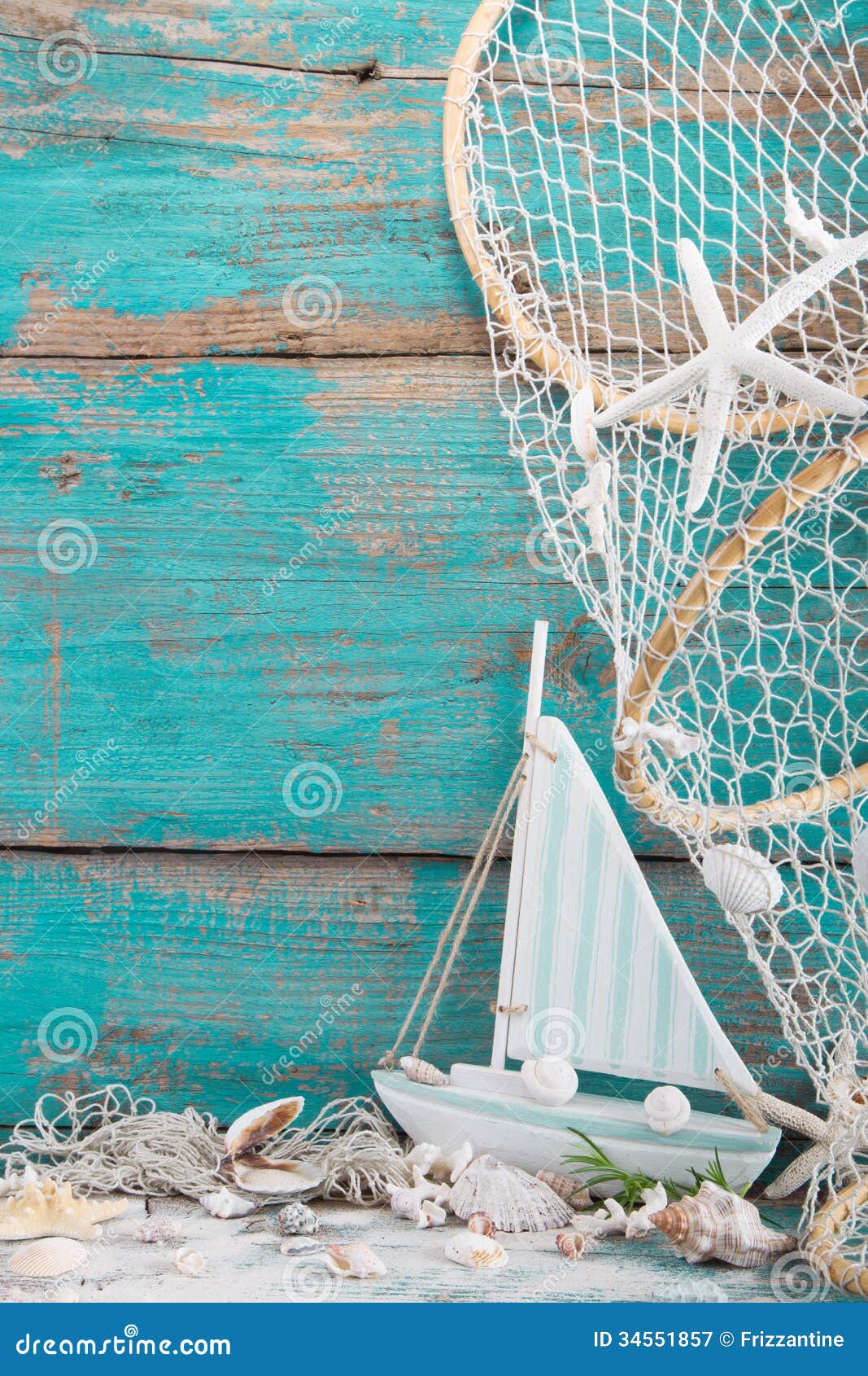 sailboat with shells and fishing net on turquoise