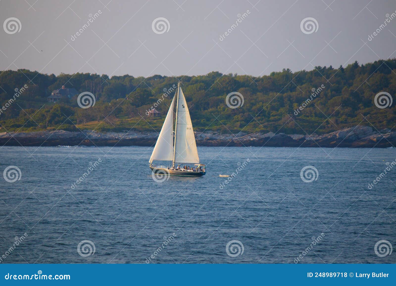 sailboat slowly drifting across the bay