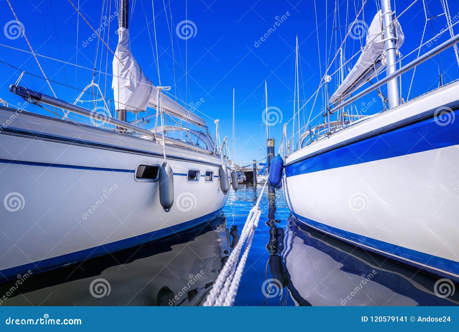 Sailing boats against a blue sky