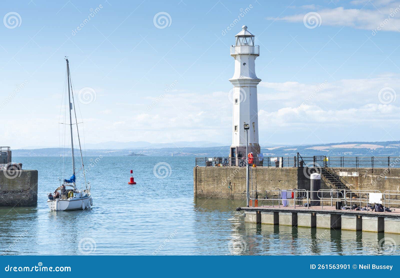 sailing yacht leaving newhaven harbour ,into the firth of forth,edinburgh,scotland,uk