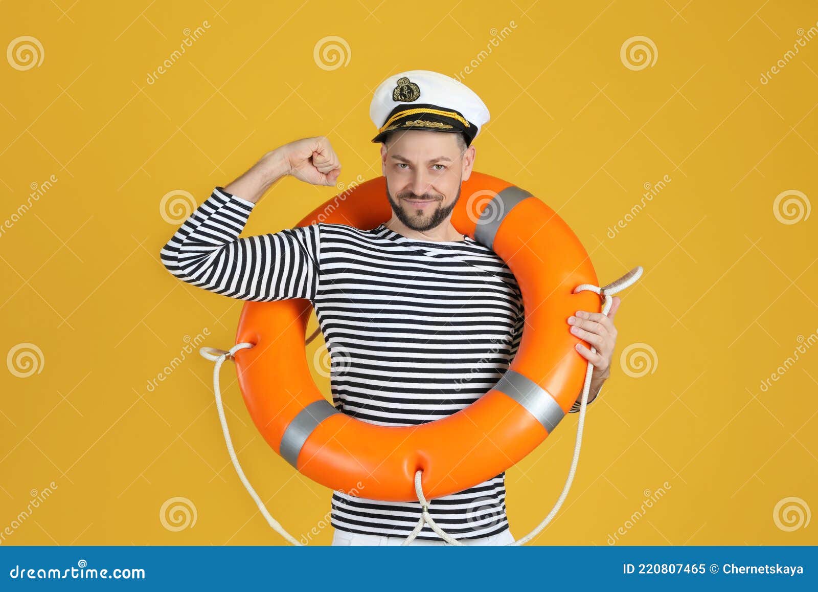 Sailor with Orange Ring Buoy Showing Biceps on Yellow Background Stock ...