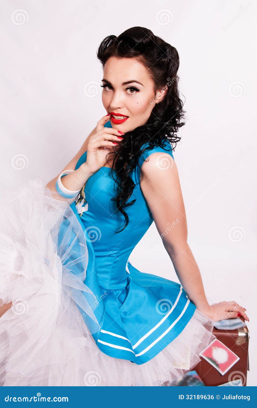 Sailor Pin Up Girl With Bright Make Up Sitting On A