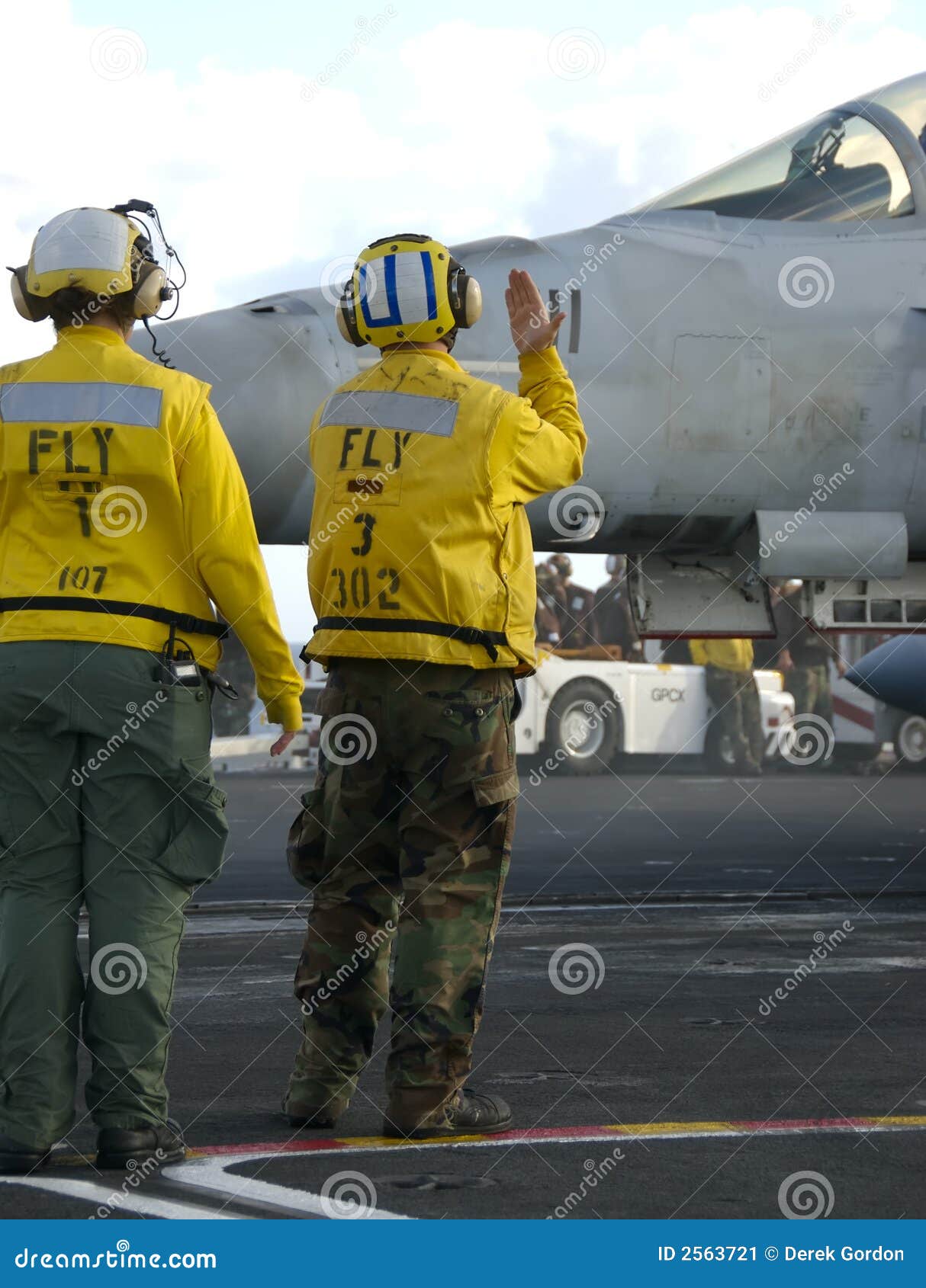 sailors at work on flight deck