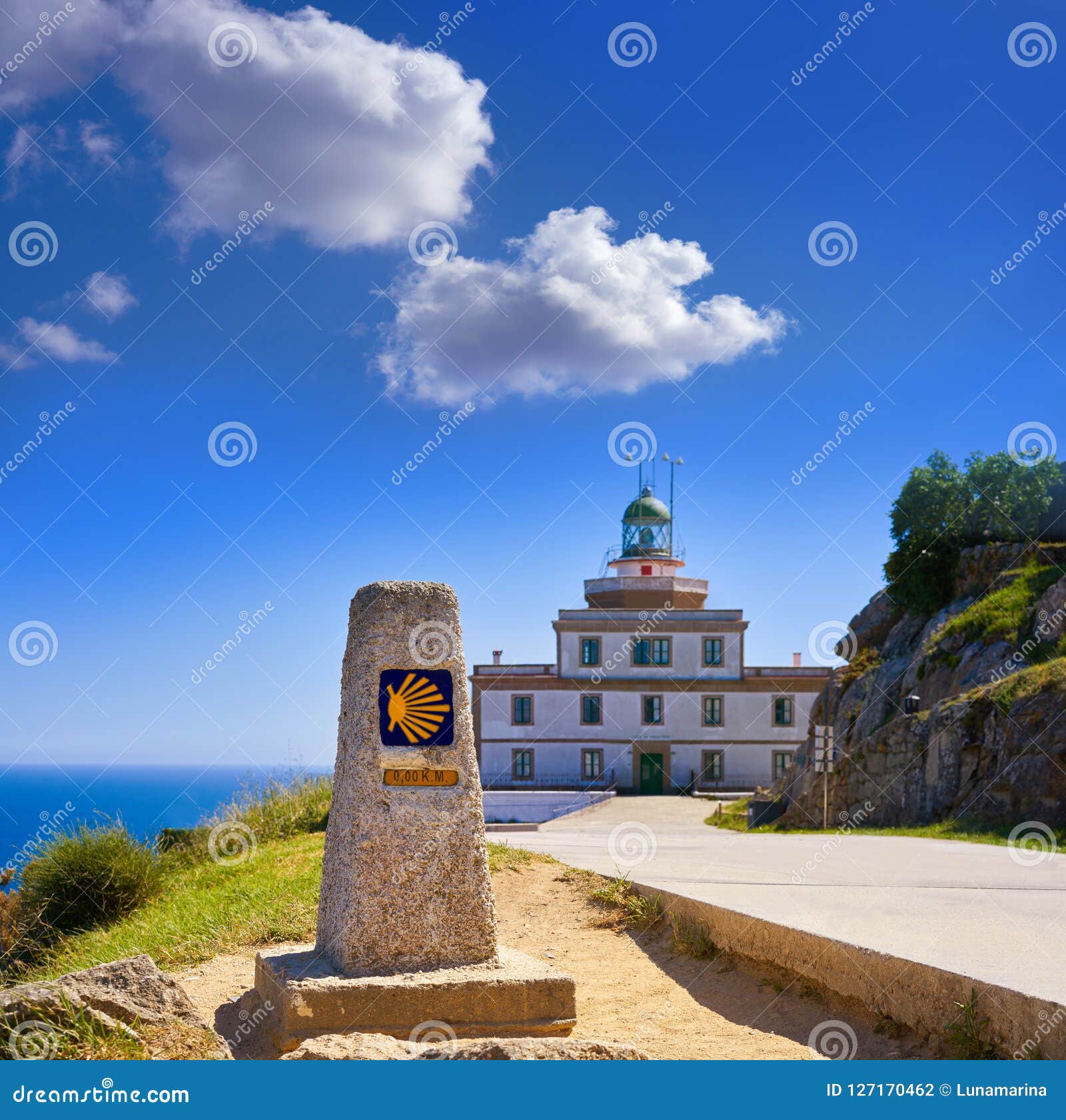 saint james way sign and lighthouse of finisterre