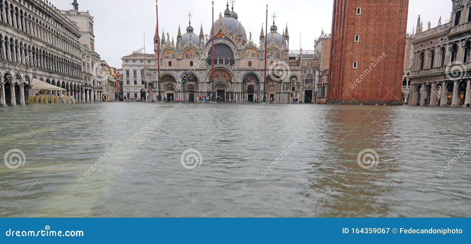 saint mark square and the basilica with high water in venice ita