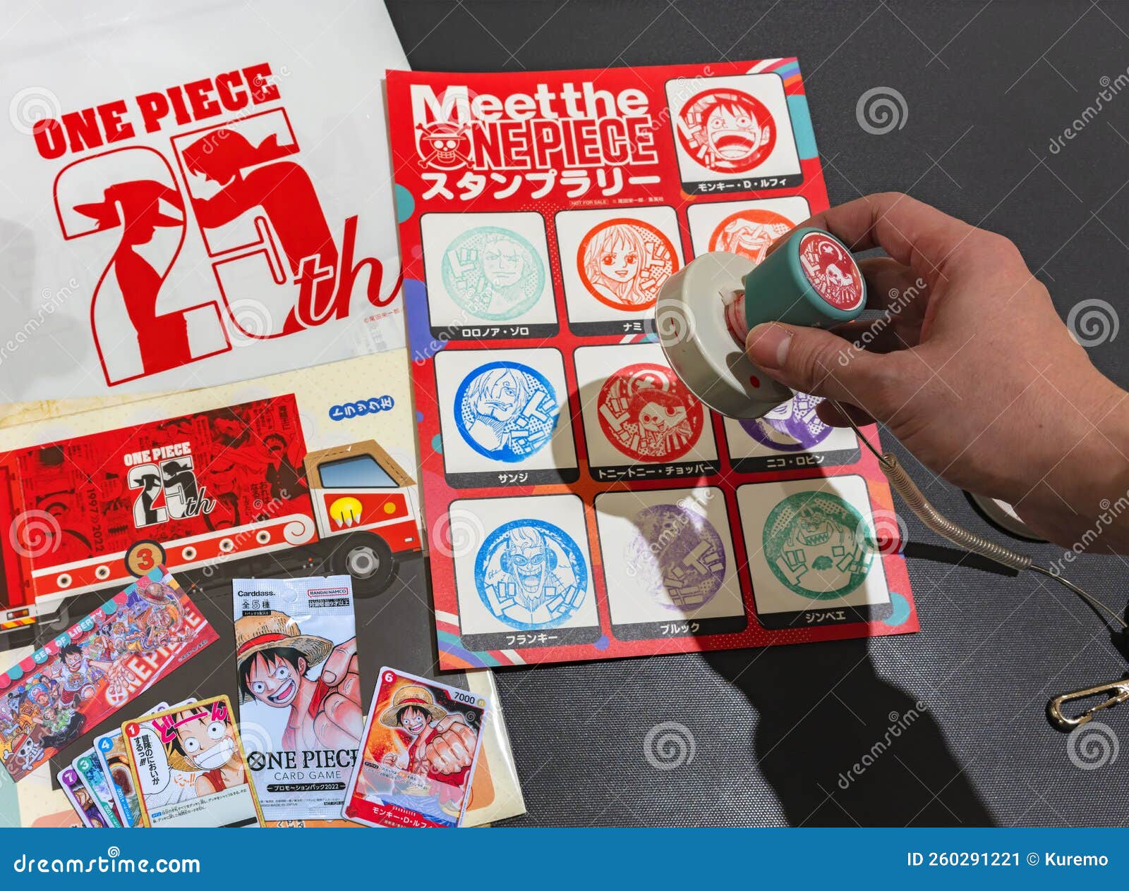 Hand Holding a Rubber Stamp of Characters from Japanese Manga One