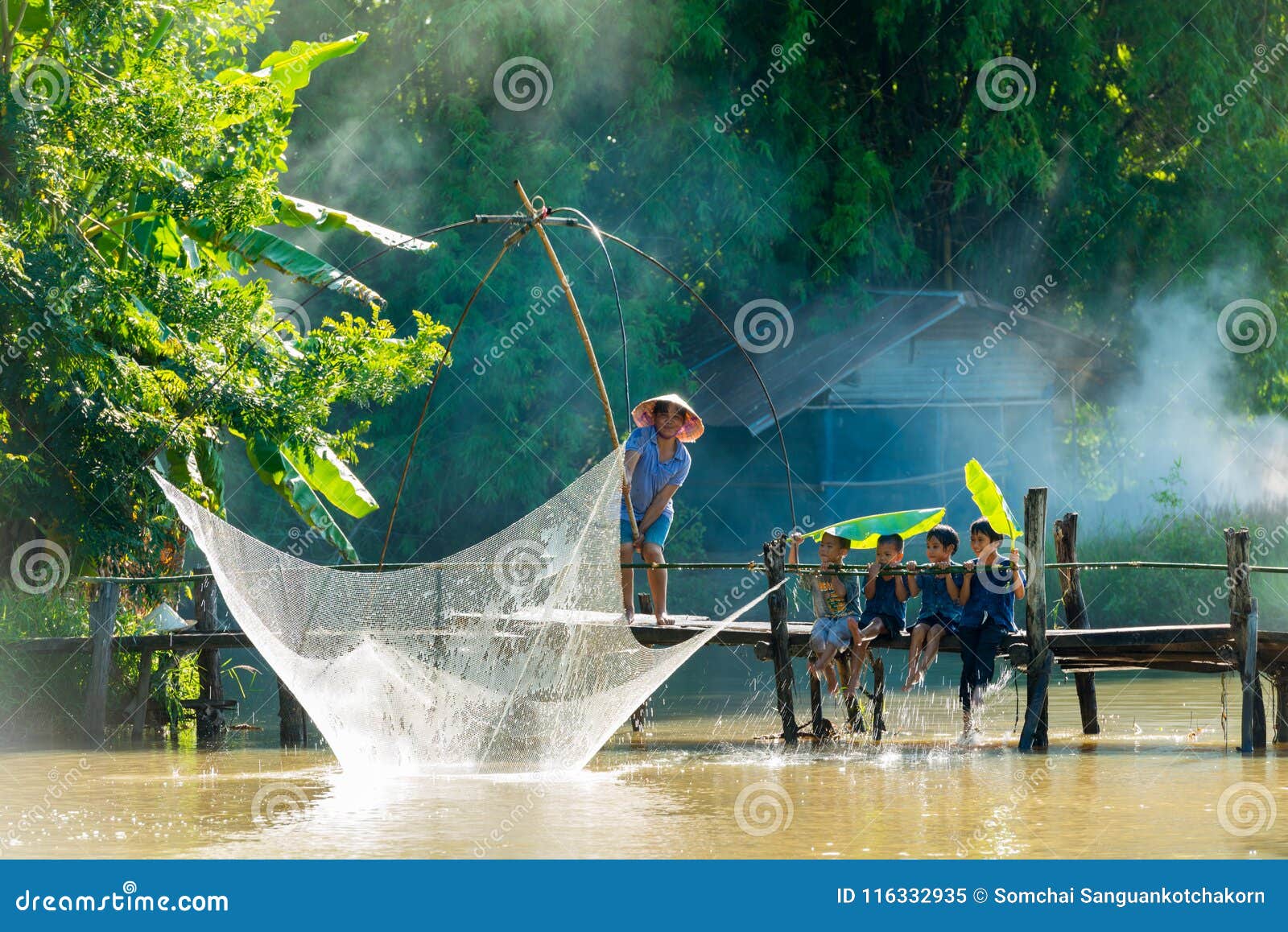 Rural Man Fishing by Fishing Net while Group of Rural Children