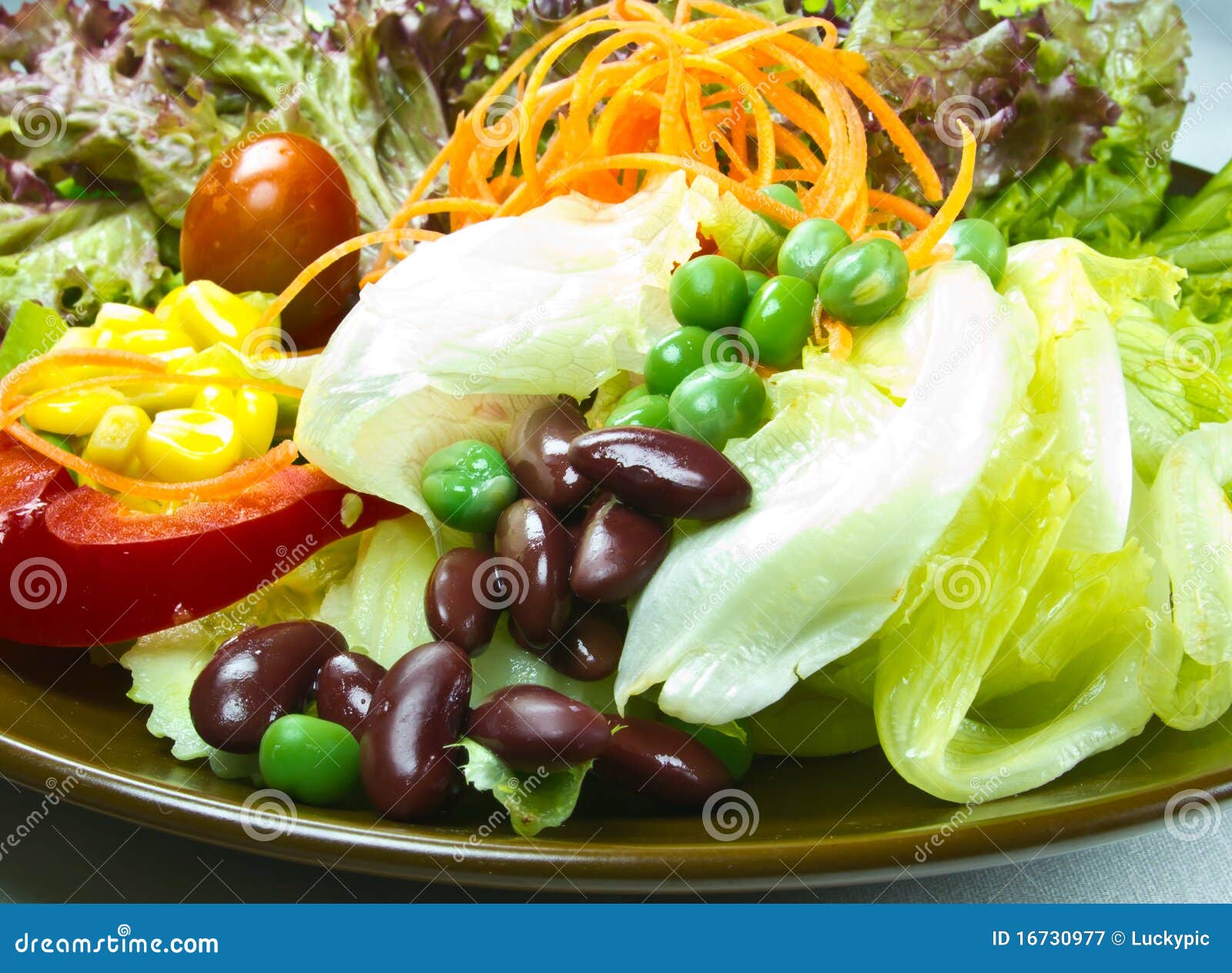 Salad on brown plate stock image. Image of meal, cucumber - 16730977
