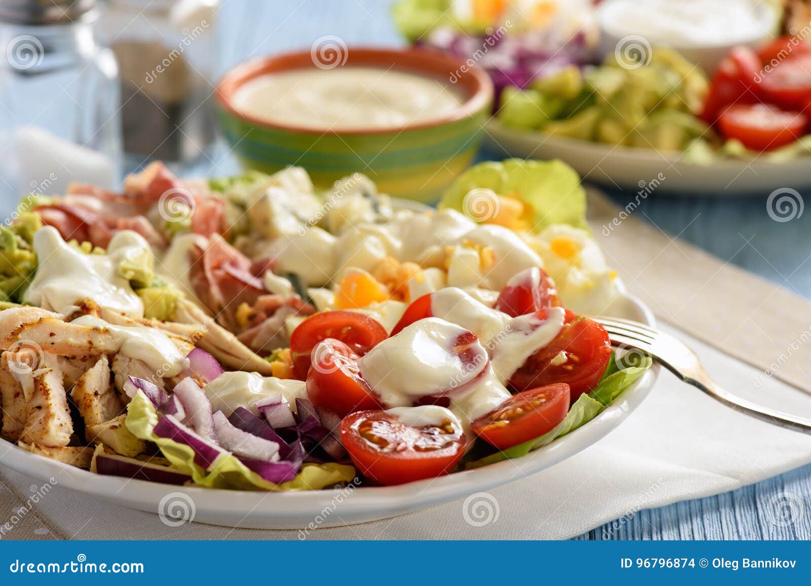 salad cobb- avocado, tomatoes, bacon, chicken and onion.