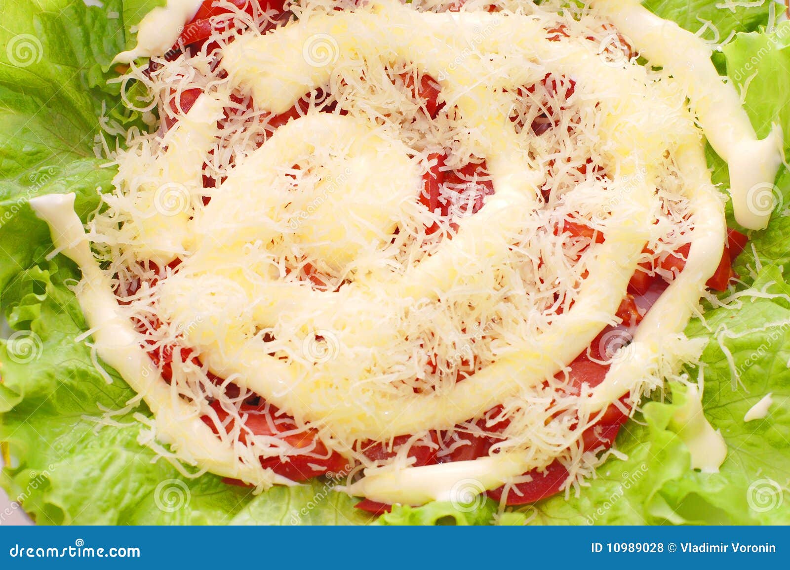 salad consists of tomatos, ground cheese