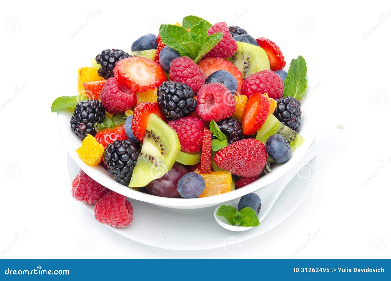 Salad of fresh fruit and berries in a bowl isolated on white, closeup Salad of fresh fruit and berries in a bowl isolated on white, closeup