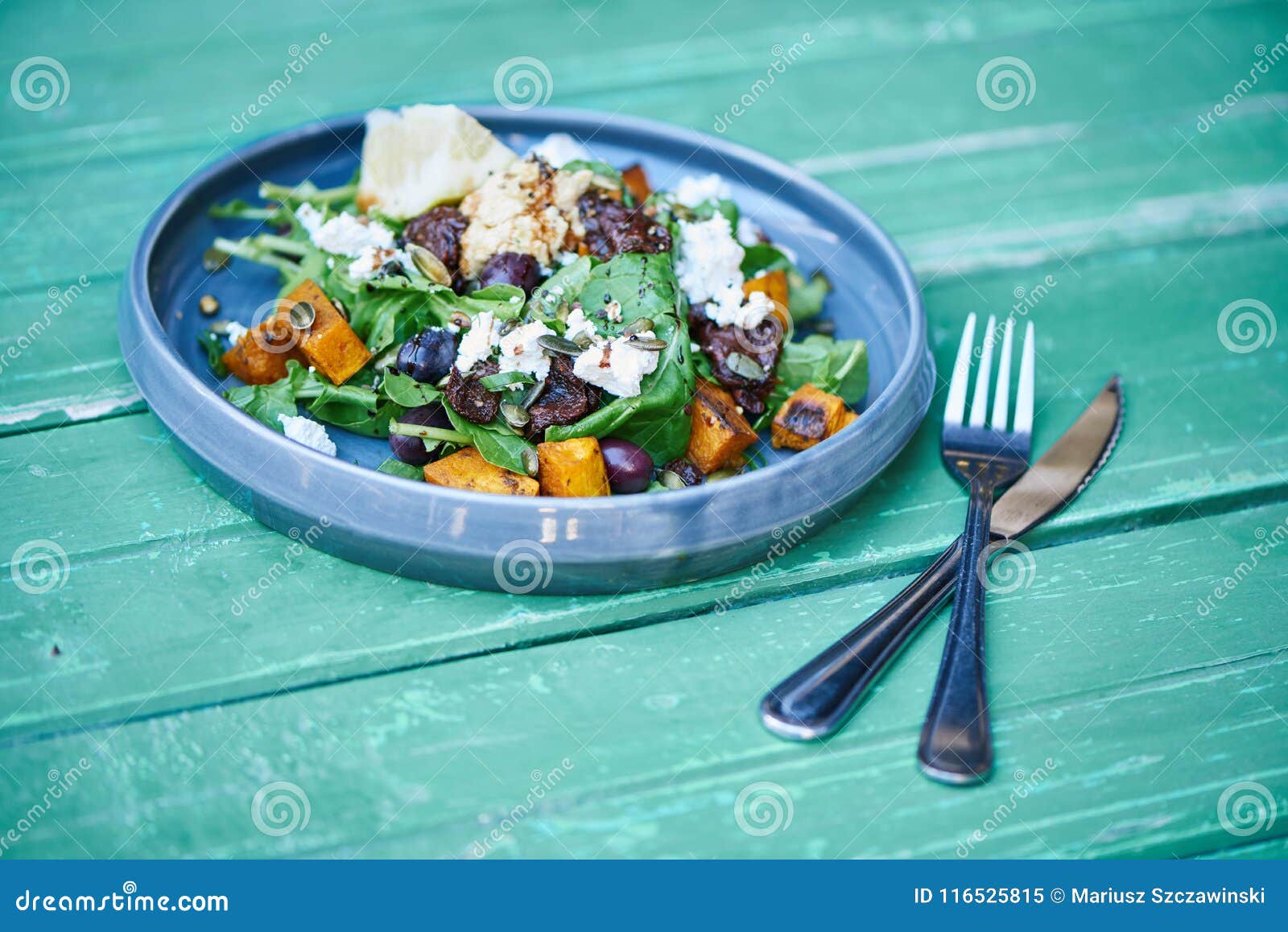 Delicious Mixed Salad Sitting On A Rustic Turquoise Wooden Table Stock