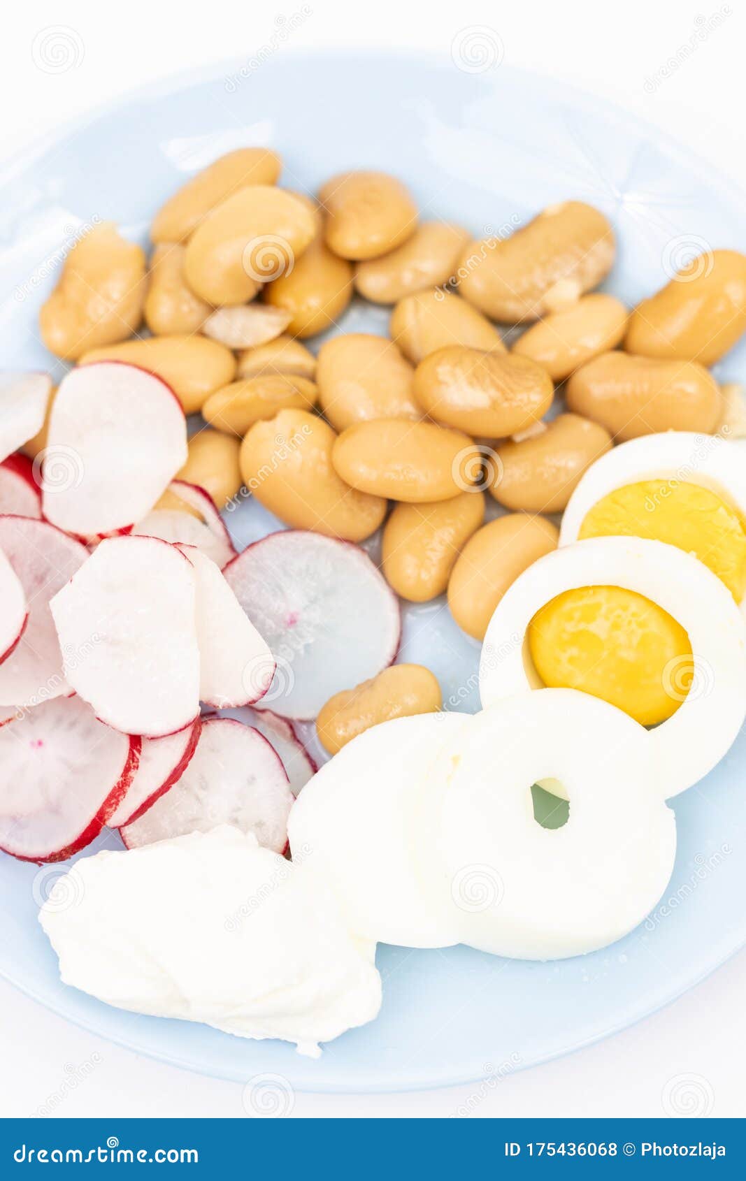 Salad with Sliced Boiled Eggs, Cooked Beans, Sliced Radishes and Sour