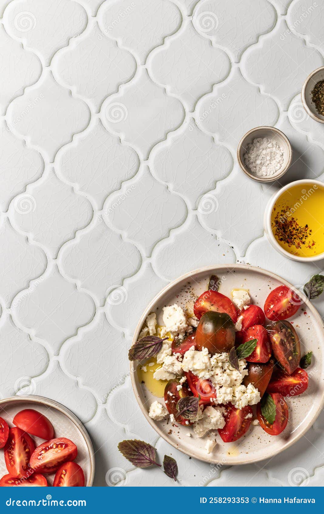 Salad with Tomatoes, Feta Cheese and Bazil Leaves Served for Dinner on