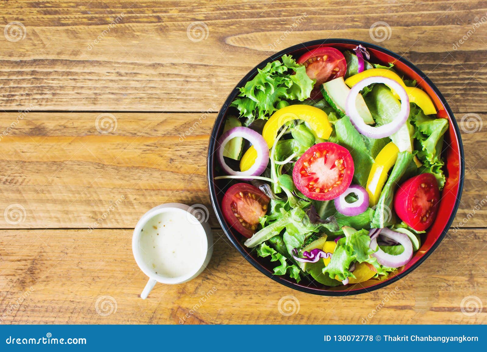 Salad on wooden floor stock photo. Image of meal, colorful - 130072778