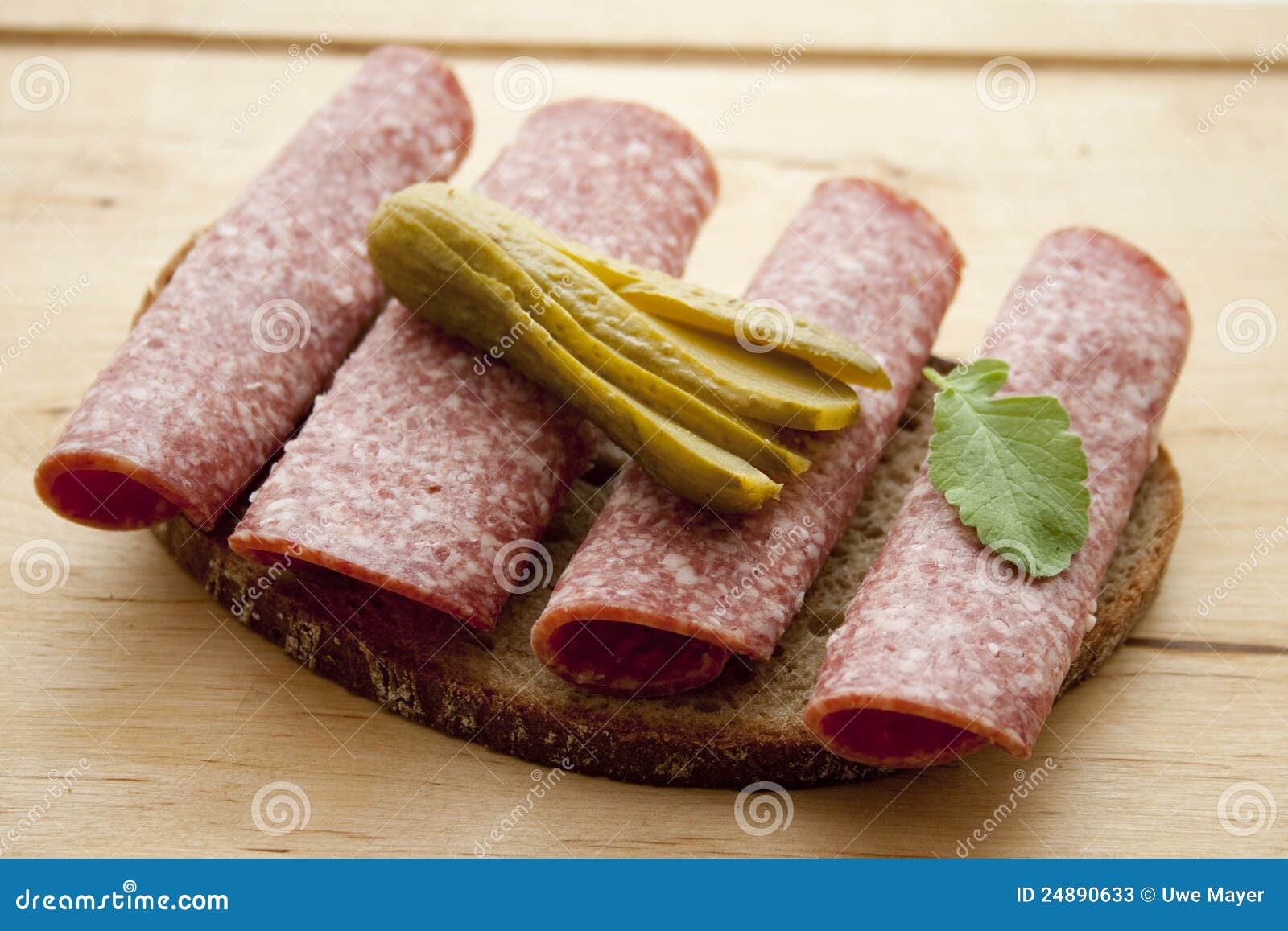 Salami bread with gherkin stock image. Image of cutting 24890633