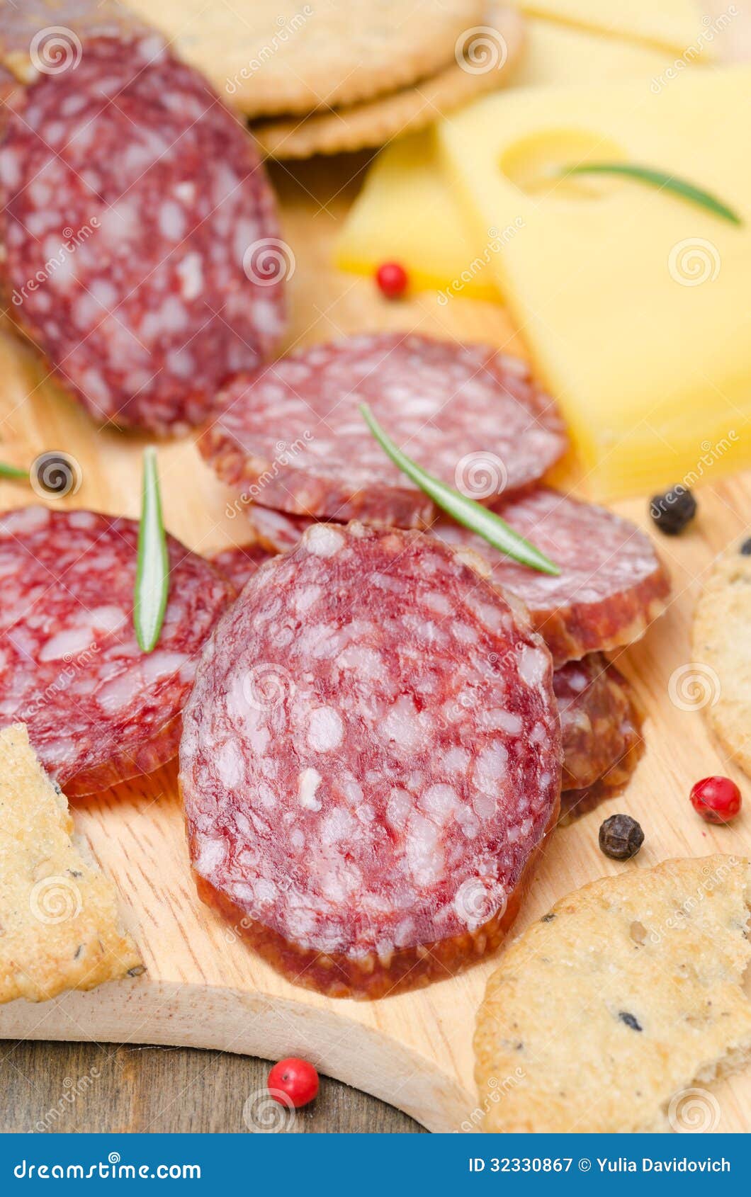 Salami, Cheese and Crackers on a Cutting Board, Closeup Stock Image