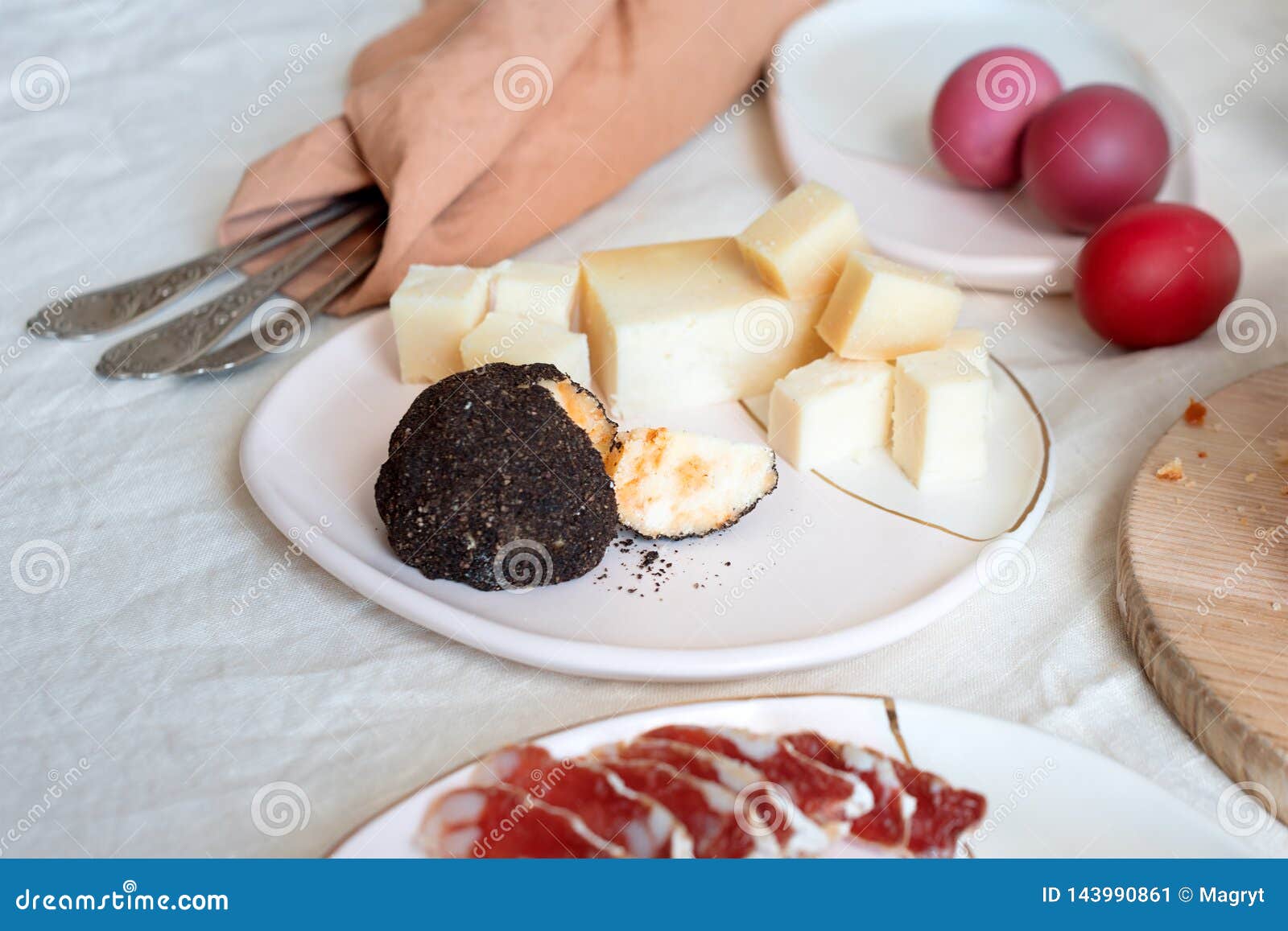 Salami and Cheese, Traditional Italian Appetizers. Easter Painted Eggs