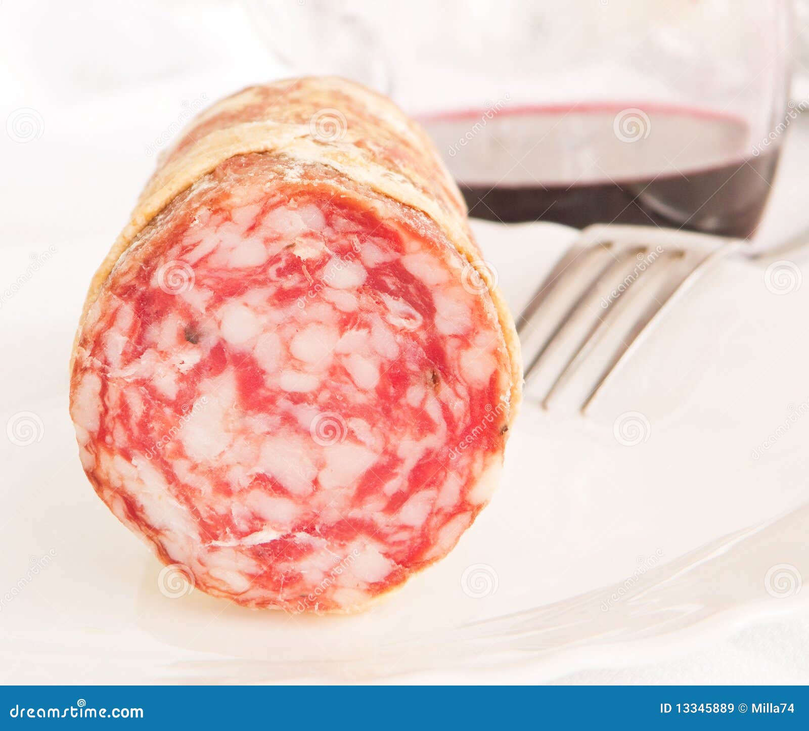 Salami on white dish. stock image. Image of gastronomy 13345889