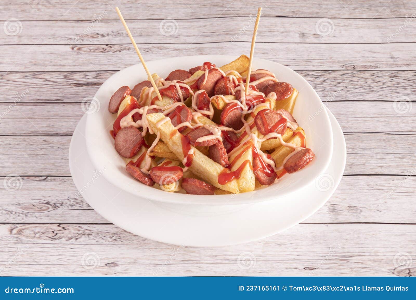 salchipapa a fast food consisting of fried slices of sausage and french fries, consumed as street food in latin america