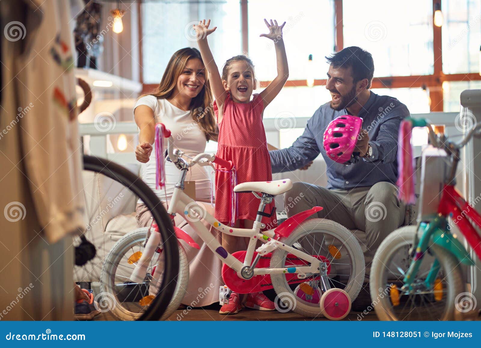 sale, consumerism and people concept - happy family with child and shopping new bicycle